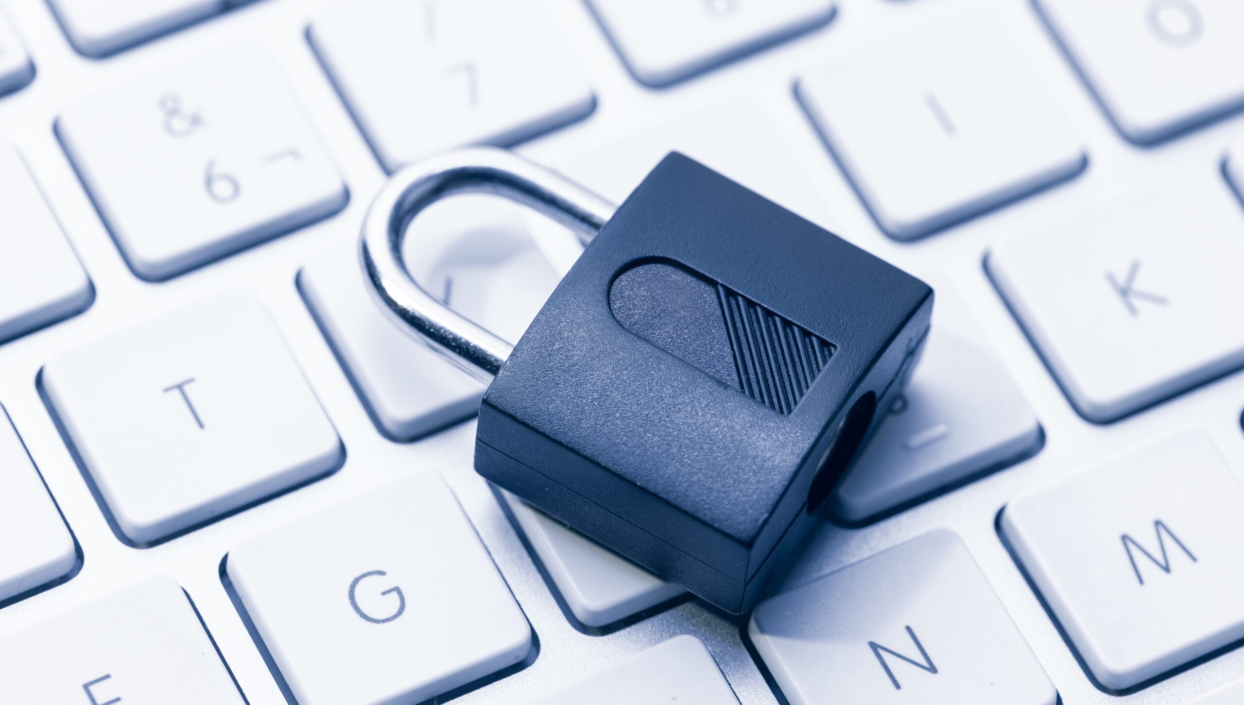 Computer Security and data privacy concept. Closed padlock on computer keyboard